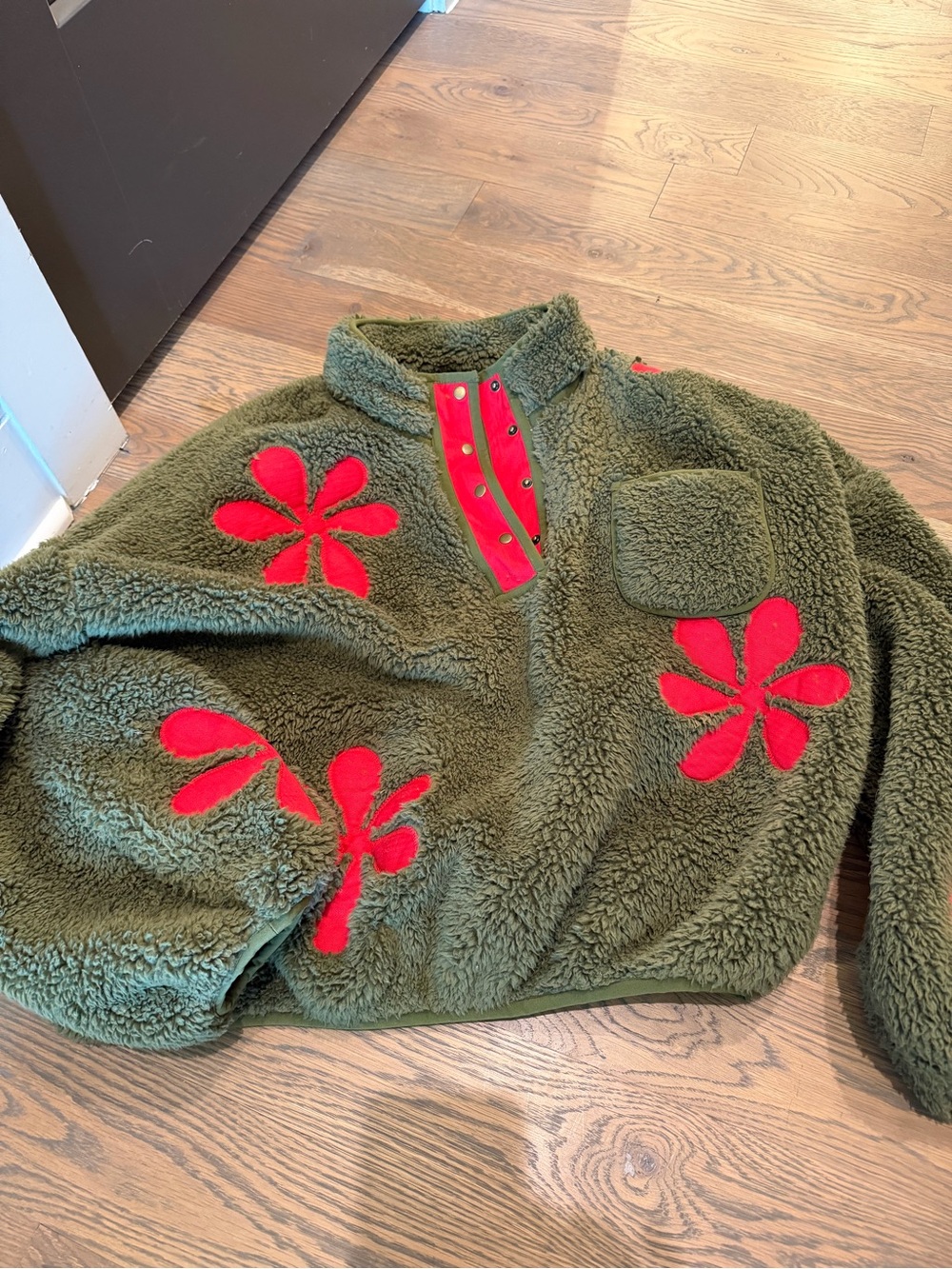 THE GREAT. Olive Green Fleece Pullover with Red Floral Appliqué